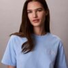 Koszulka z nadrukiem Calvin Klein w stylu kursywnym