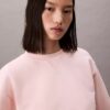 Krótka bluza z francuskiej dzianiny frotte o luźnym kroju Krótka bluza z francuskiej dzianiny frotte o luźnym kroju