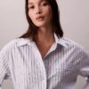 Luźna koszula z popeliny w paski, zapinana na guziki Luźna koszula z popeliny w paski, zapinana na guziki