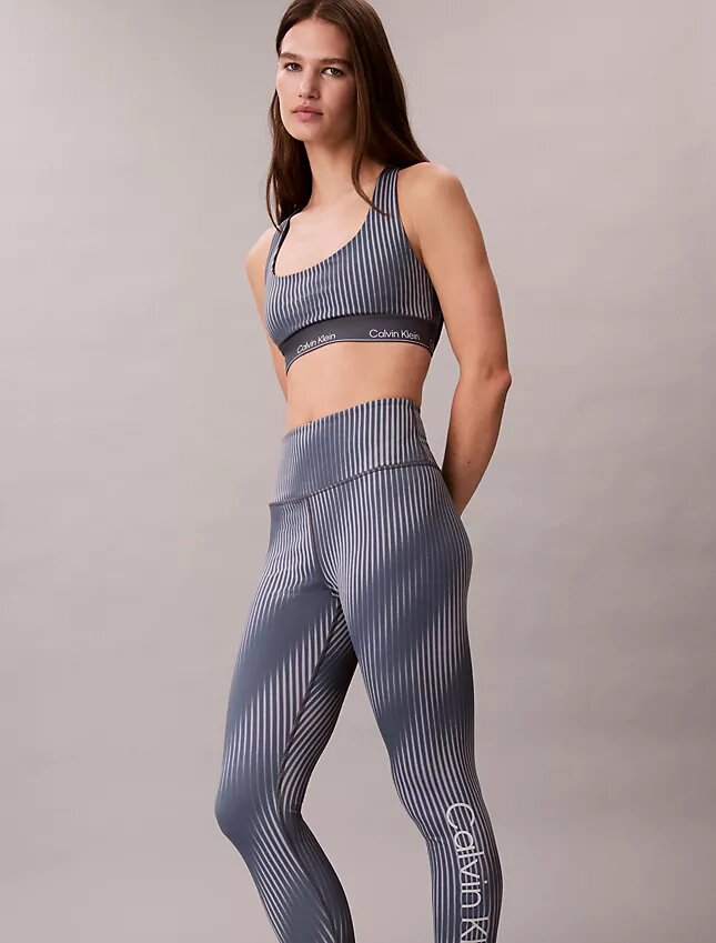 Nowoczesne legginsy z nadrukiem sportowym, z wysokim stanem i długością 7/8 Nowoczesne legginsy z nadrukiem sportowym, z wysokim stanem i długością 7/8