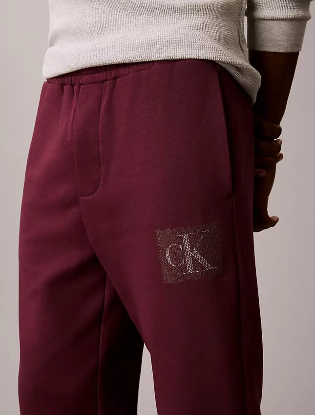 Spodnie dresowe z warstwowym nadrukiem Monogramu Spodnie dresowe z warstwowym nadrukiem Monogramu