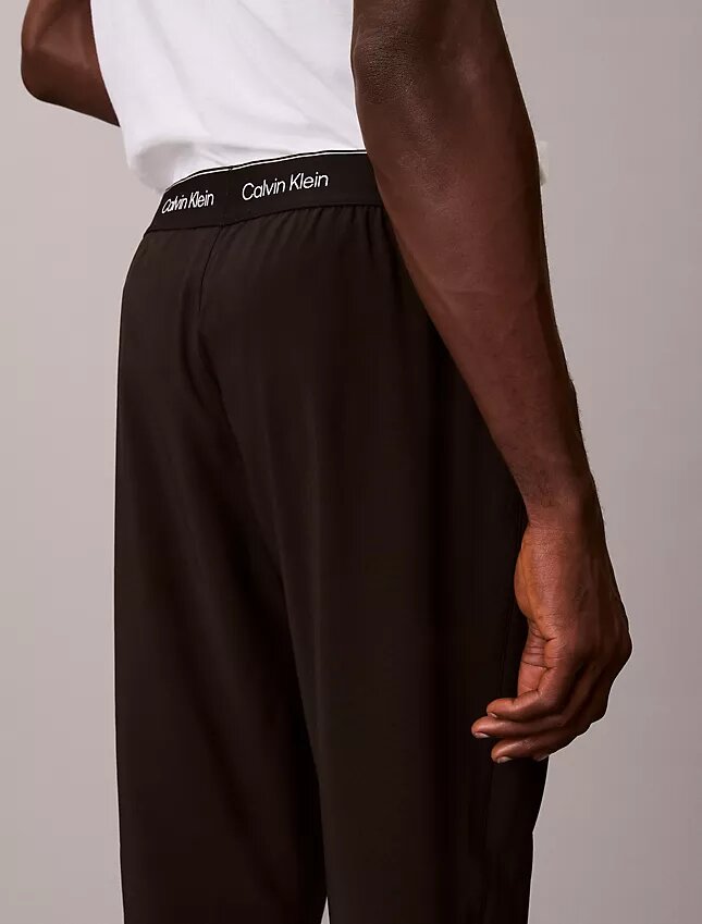 Spodnie z tkaniną w pasie z nowoczesnym logo sportowym Spodnie z tkaniną w pasie z nowoczesnym logo sportowym