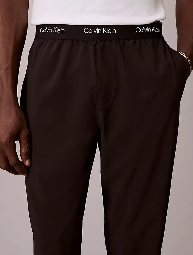 Spodnie z tkaniną w pasie z nowoczesnym logo sportowym Spodnie z tkaniną w pasie z nowoczesnym logo sportowym